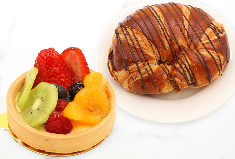 Tart and Croissant on Marble Surface